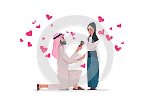 Arab man kneeling holding engagement ring proposing arabic woman marry him happy valentines day concept couple in love