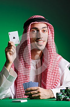 Arab man playing in the casino