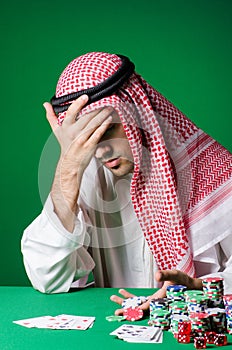 The arab man playing in the casino
