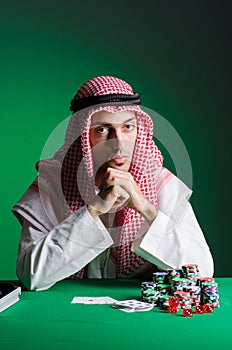 The arab man playing in the casino