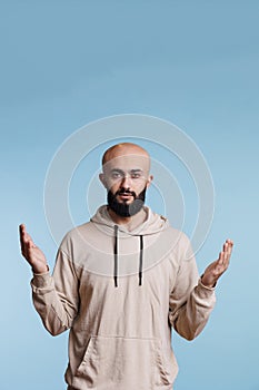 Arab man praying in spiritual gesture