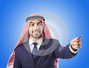 Arab man pressing virtual buttons