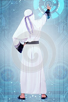 The arab man pressing virtual buttons in futuristic concept