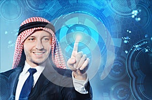 The arab man pressing virtual buttons in futuristic concept