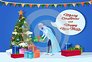 Arab man putting gift box under fir-tree happy new year merry christmas concept chat bubble male cartoon character