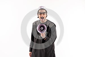 Arab man speaks in megaphone. Announcements concept.