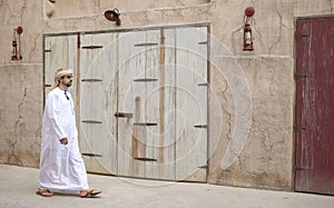 Arab Man walking in Al Seef are of Dubai