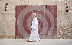 Arab Man walking in Al Seef are of Dubai