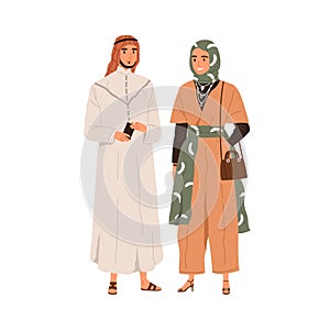 Arab man and woman in modern fashion clothes. Muslim couple portrait wearing hijab, tunic and male headwear. Arabian