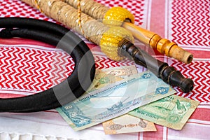 Arab Money Dirham Bank note, , hookah and Traditional Arab Male Clothes - kaffiyah and agal photo