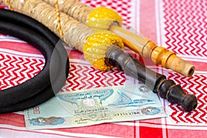 Arab Money Dirham Bank note, hookah and Traditional Arab Male Clothes - kaffiyah photo