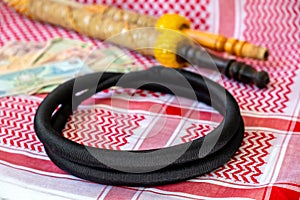 Arab Money Dirham Bank note, , hookah and Traditional Arab Male Clothes - kaffiyah and agal  close-up photo