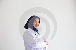 Arab Muslim doctor or nurse standing uniform white has stethoscope in the hospital, Portrait young hijab of a smiling area