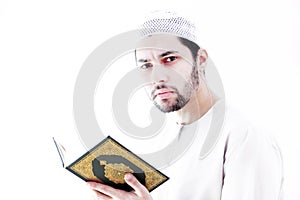 Arab muslim man with koran holy book