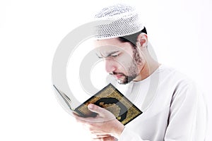 Arab muslim man with koran holy book