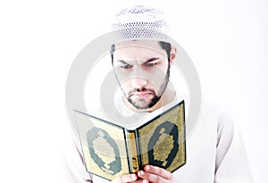 Arab muslim man with koran holy book