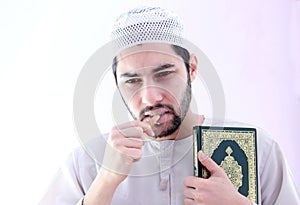 Arab muslim man with toothbrush miswak