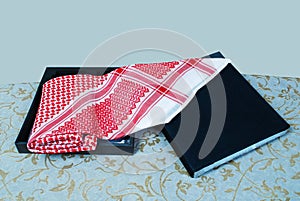 Arab Muslim men,s cultural head scarf named Shemagh isolated red and white fabric clothing accessory middle eastern traditional