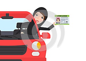 arab muslim woman sitting in car showing driving license
