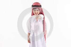 Arab offended boy is showing thumb down.