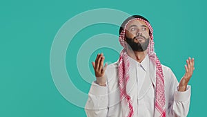 Arab person seeks to Allah on camera