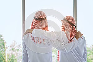 Arab saudi businessman with friend in hotel