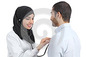 Arab saudi doctor woman examining patient