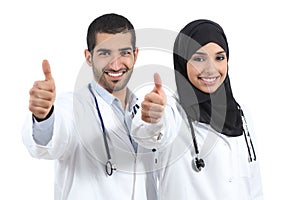 Arab saudi emirates doctors happy with thums up photo