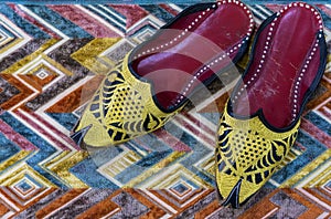Arab shoes, top view, carpet background