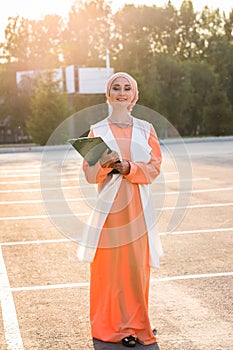 Arab Student holding a folder