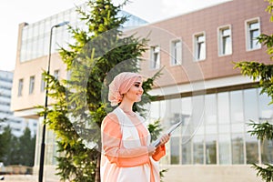 Arab Student holding a folder