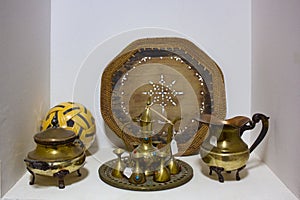 Arab traditional old antique items. Brass coffee pot,cups,plates and trays