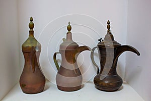 Arab traditional old antique items. Brass coffee pot,cups,plates and trays