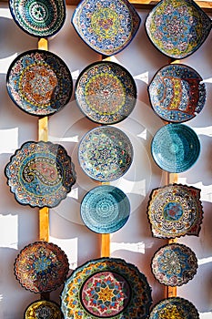 Arab Uzbek ceramic plates hand-painted at oriental street bazaar in Uzbekistan