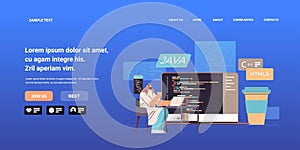 arab web developer creating program code on laptop screen development of software and programming concept