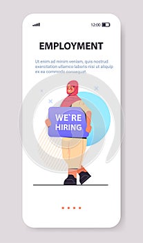 arab woman hr manager holding we are hiring poster vacancy open recruitment human resources employment