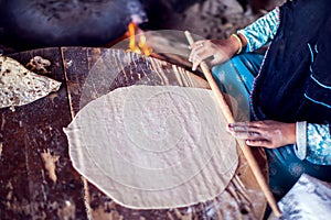 Arab woman makes bread in the beduin village in Egypt