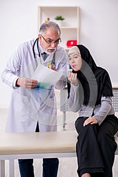 Arab woman visiting experienced doctor