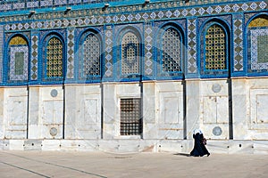 Arab women in hijab, burka walking near the Dome of the Rock, Jerusalem