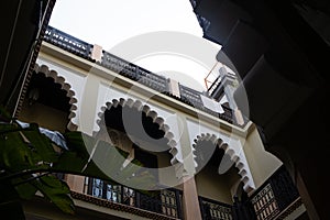 Arabian archs in a balcony facade indoor patio in a Riyad in Marrakesh, Morocco