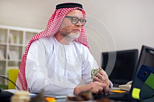Arabian business man in his home office