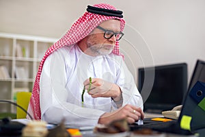 Arabian business man in his home office