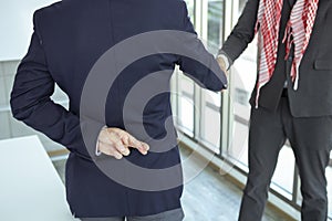 Arabian Business man shaking hand with lie sign