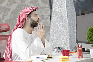 Arabian business man working on Laptop in the office