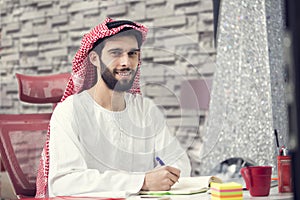 Arabian business man working on Laptop in the office