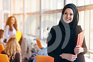 Arabian business woman with hijab holding a folder