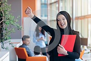 Arabian business woman with hijab holding a folder