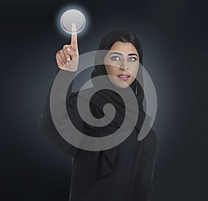 Arabian business woman pressing a touchscreen