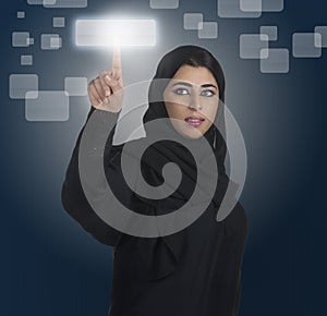 Arabian business woman pressing a touchscreen