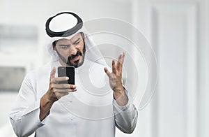 Arabian Businessman expressing anger on the phone